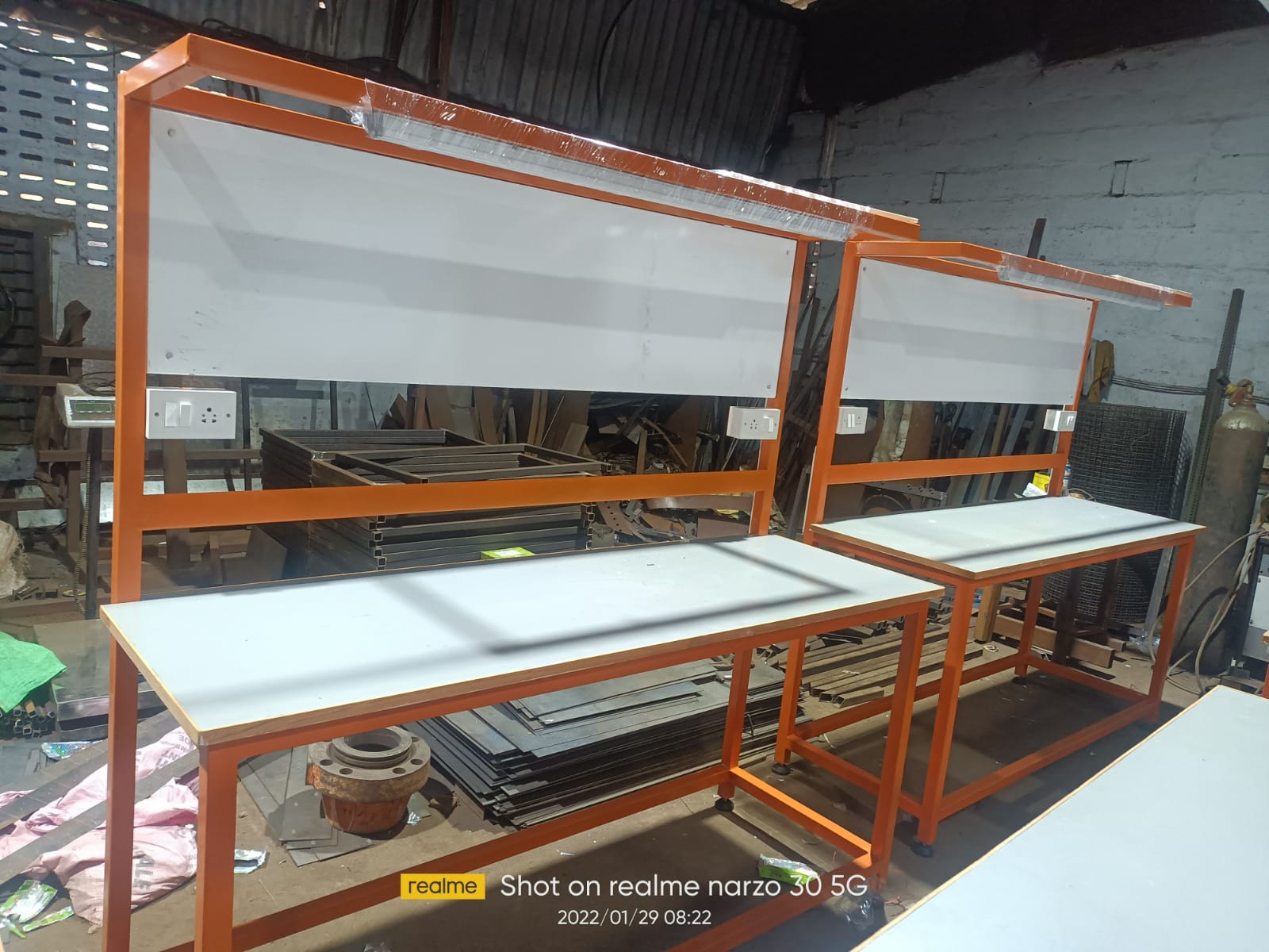 Orange framed dual inspection tables