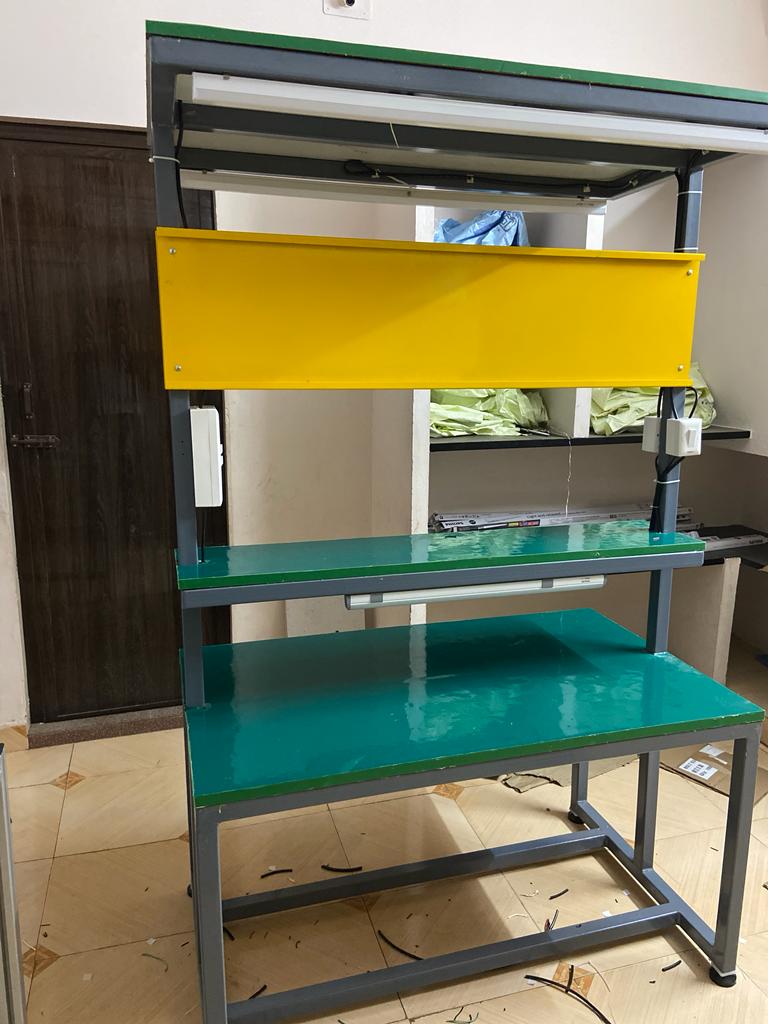 Illuminated inspection table with green worktop