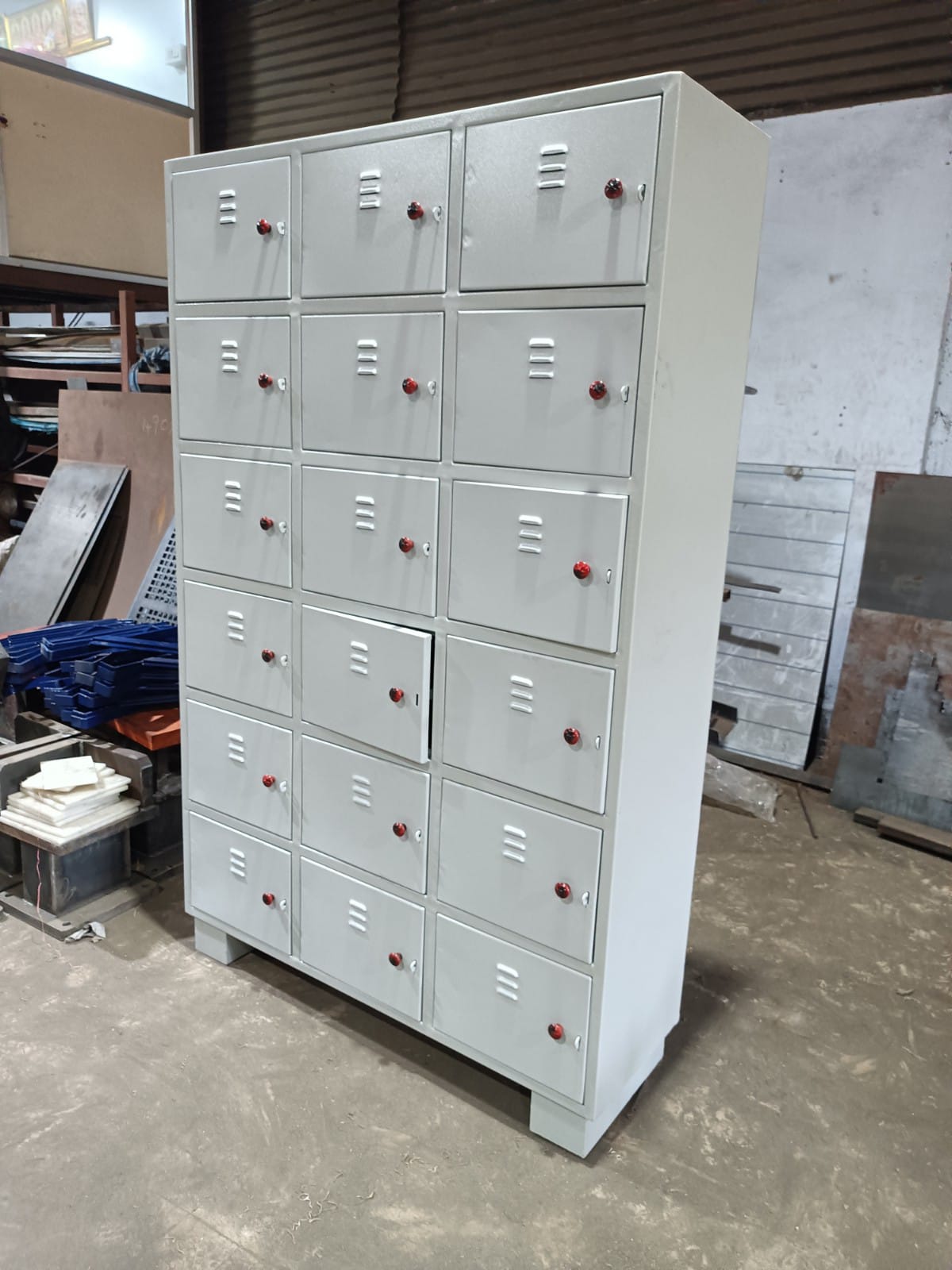 Grey multi-door industrial locker cupboard