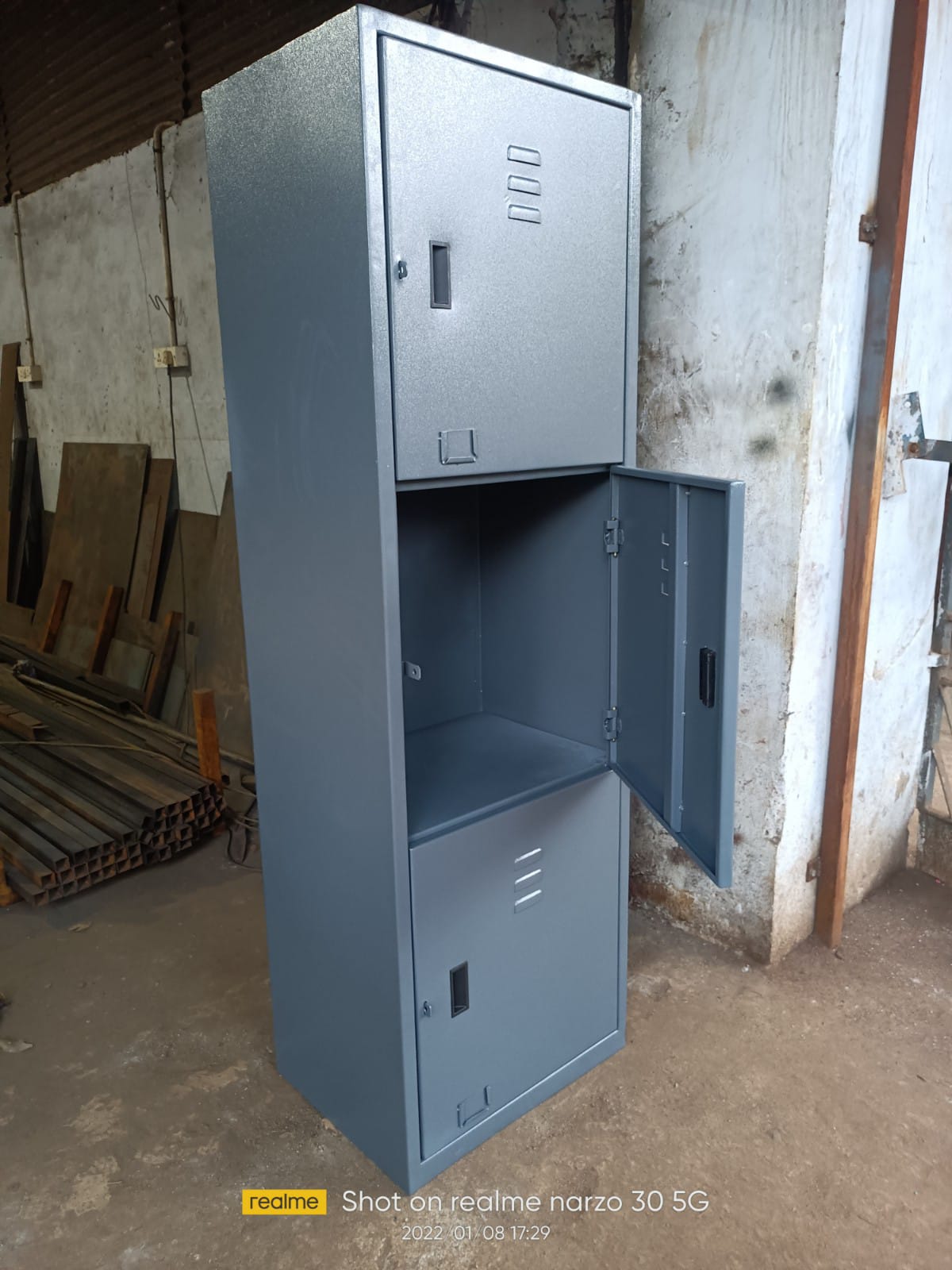 Three-door grey personal cupboard